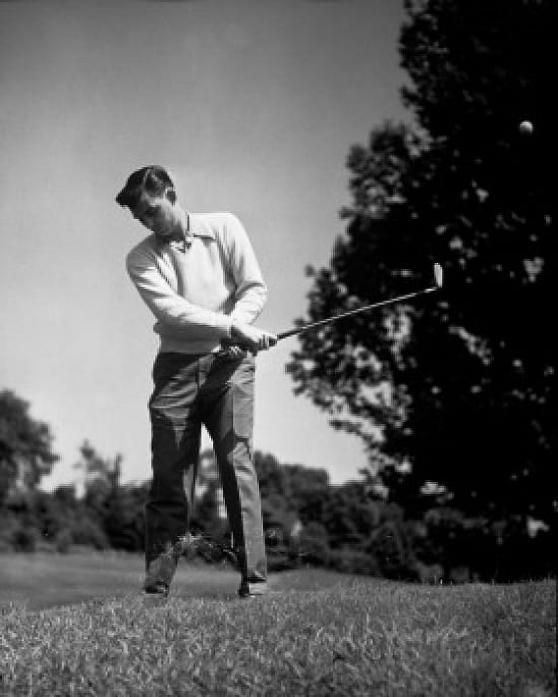 Mid adult man swinging golf club Canvas Art - (18 x 24)