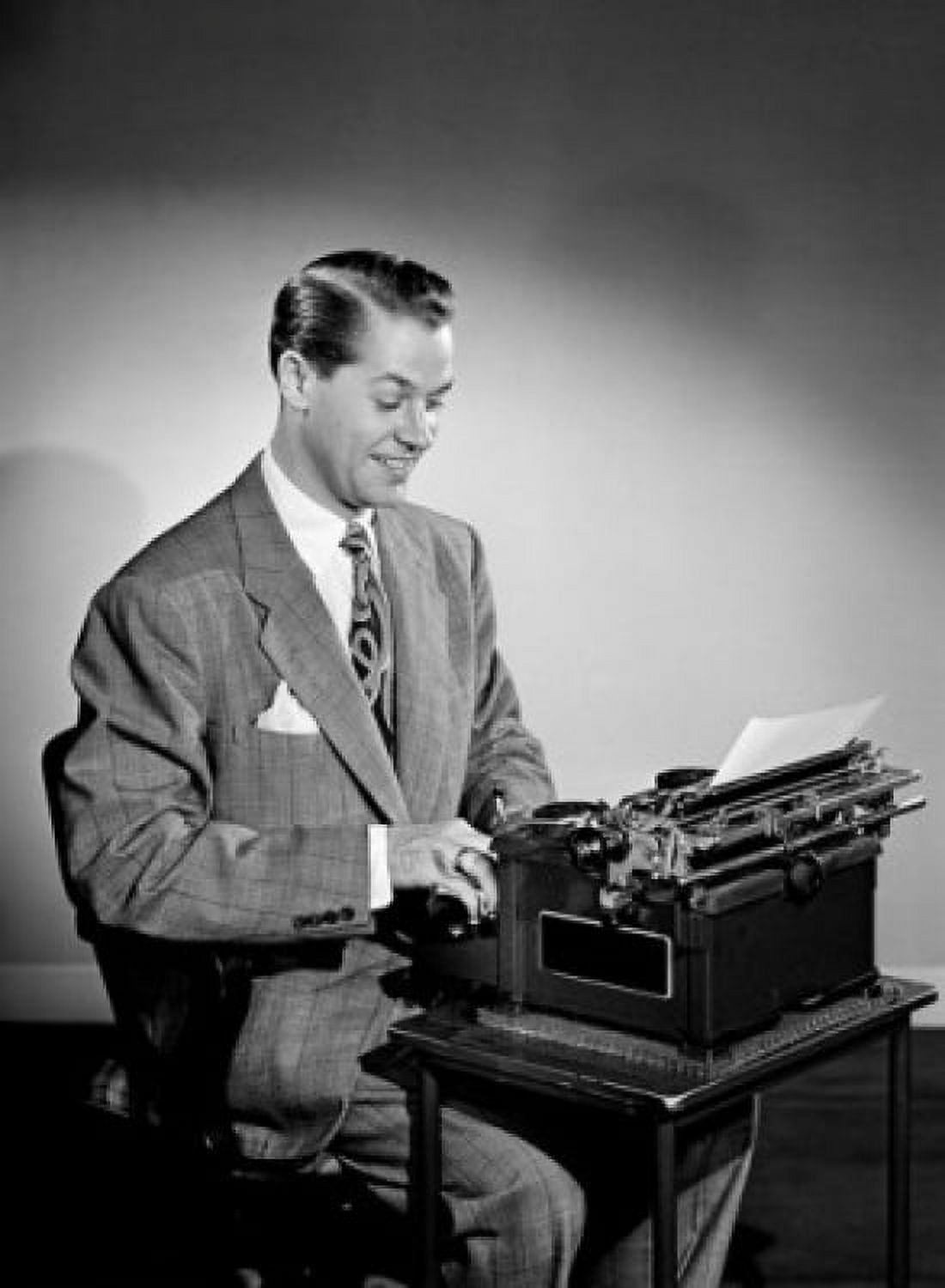 Mid adult man typing on typing machine Canvas Art - (18 x 24)