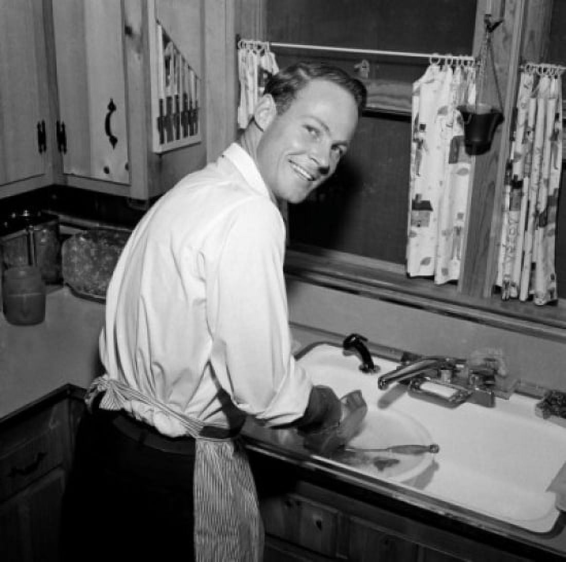 Mid adult man washing dishes Canvas Art - (24 x 36)