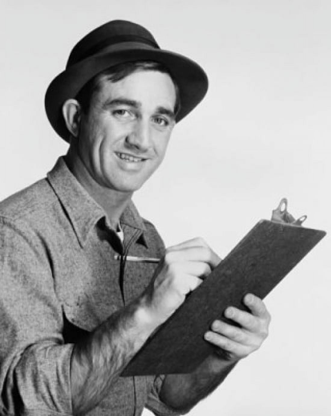 Mid adult man writing on a clipboard and smiling Canvas Art - (24 x 36)