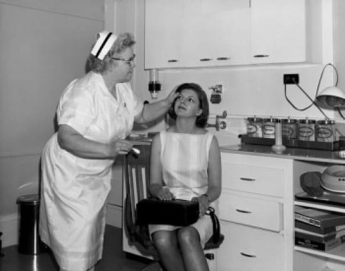 Mid adult woman and female nurse in examination room Canvas Art - (18 x 24)