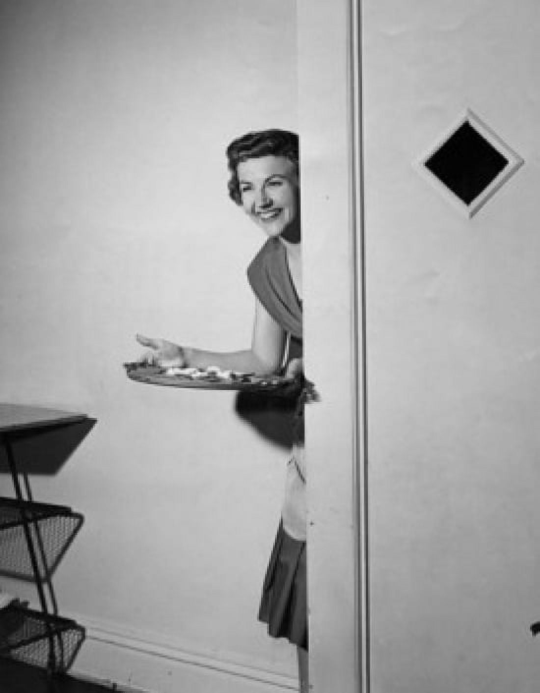 Mid adult woman carrying serving tray Canvas Art - (18 x 24)