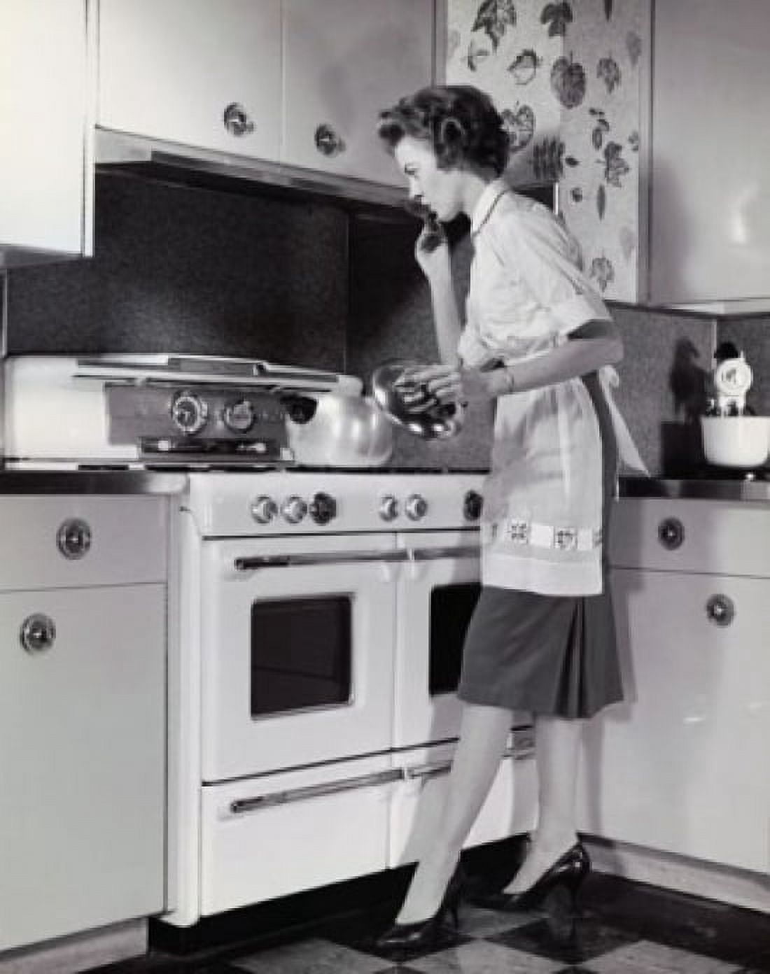 Mid adult woman cooking food in the kitchen Canvas Art - (24 x 36)