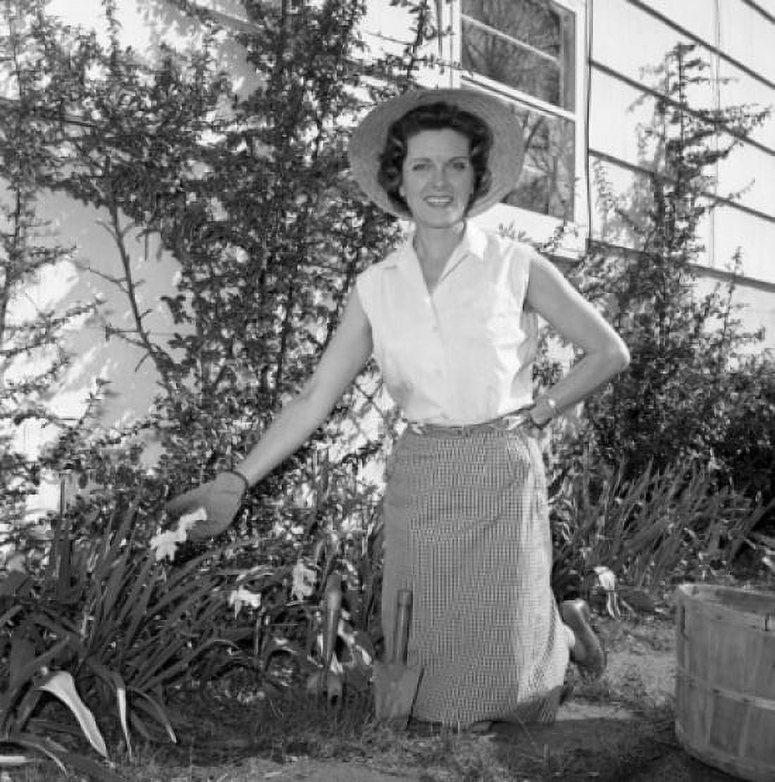 Mid adult woman gardening Canvas Art - (18 x 24)