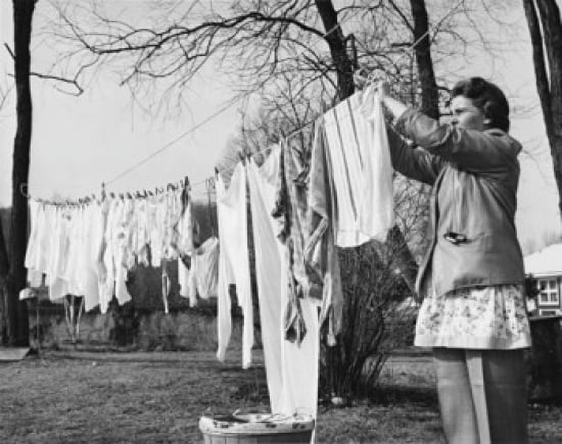 Mid adult woman hanging clothes on a clothesline Canvas Art - (18 x 24)