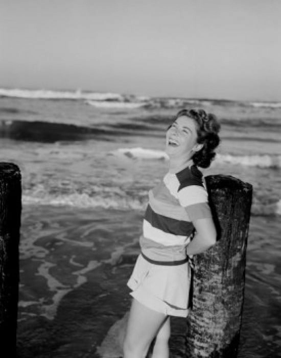 Mid-adult woman leaning against breakwater Canvas Art - (24 x 36)