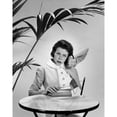 thumbnail image 1 of Mid adult woman listening to her wristwatch and looking impatient Poster Print (18 x 24), 1 of 4