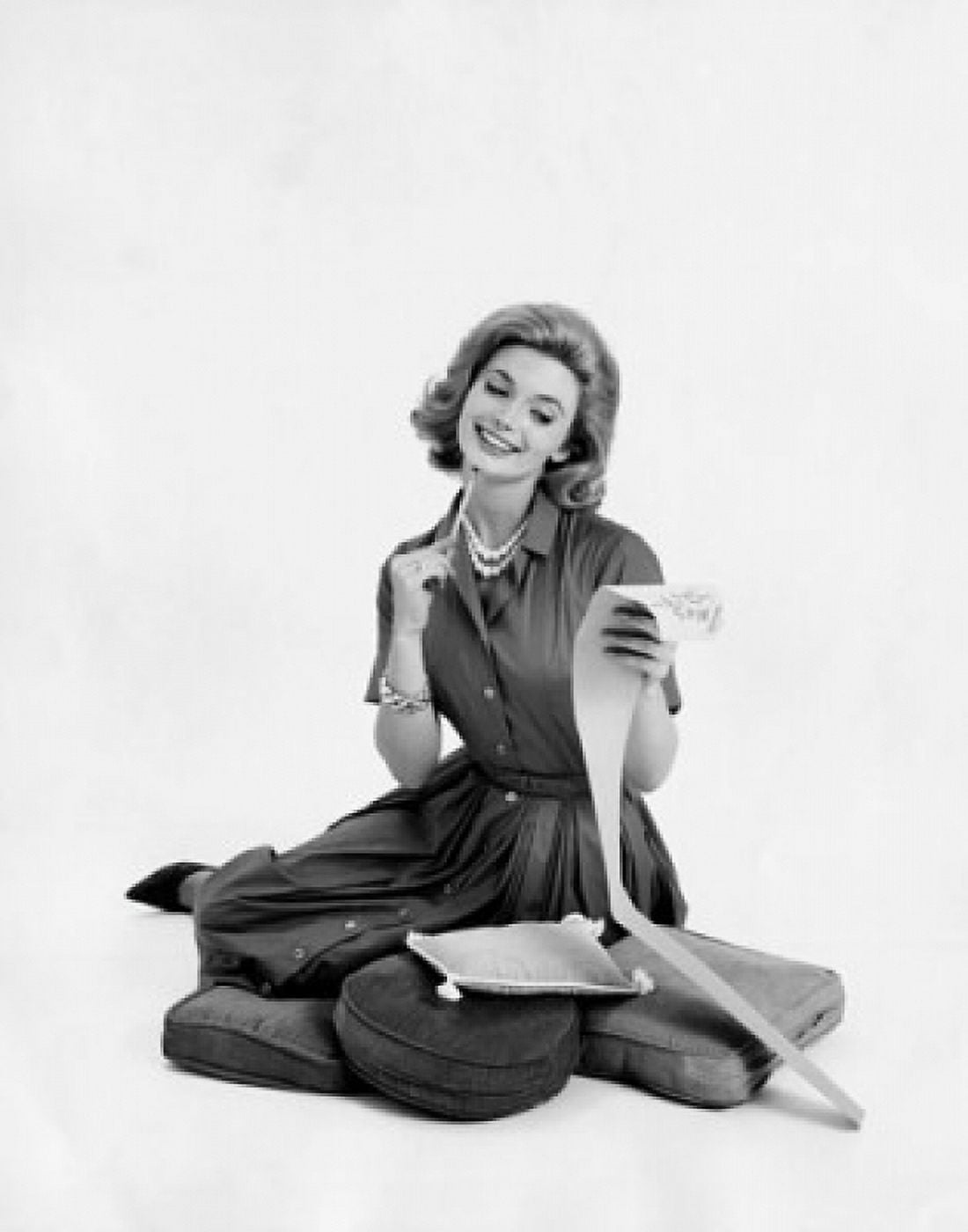 Mid adult woman looking at a list and smiling Canvas Art - (18 x 24)