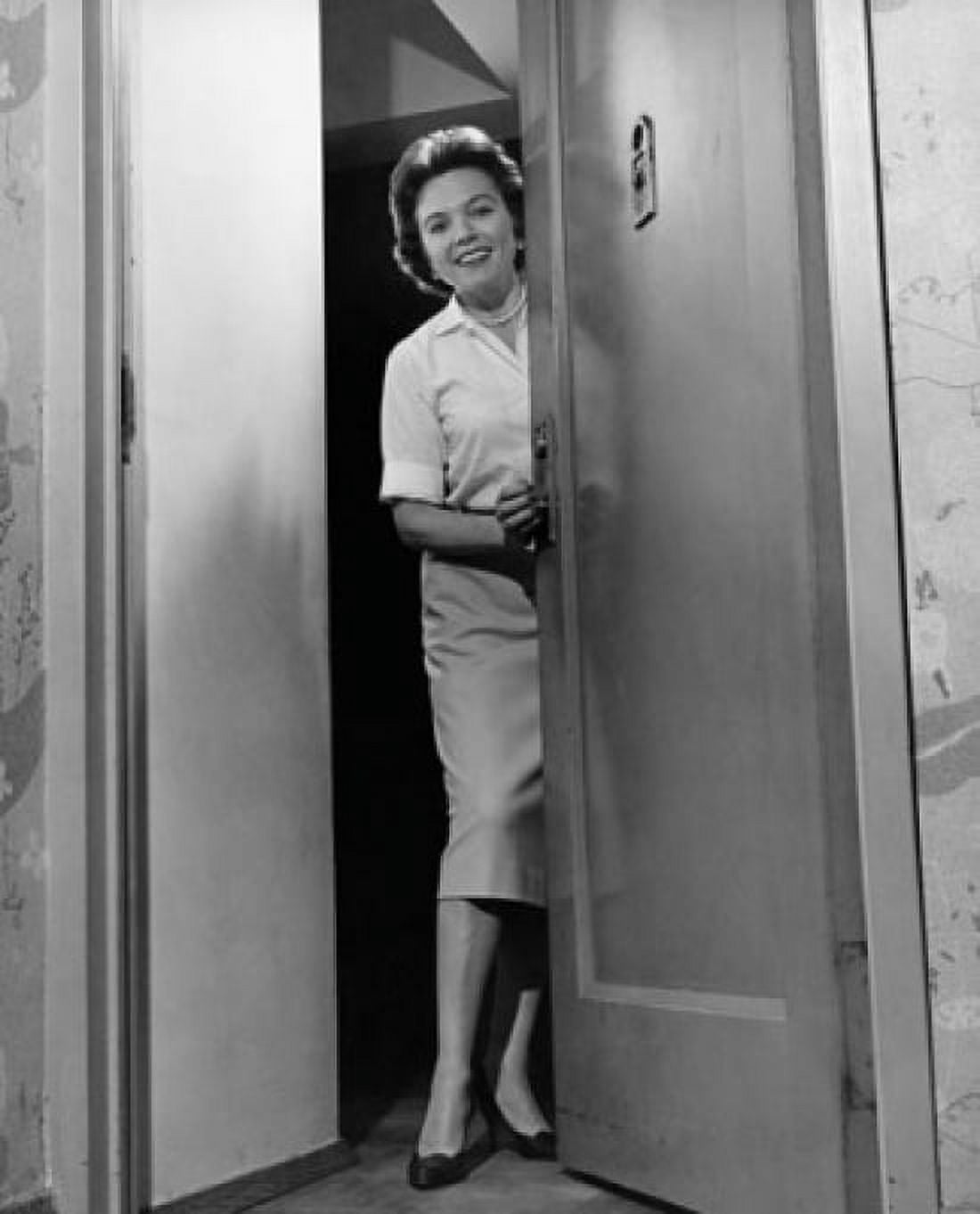 Mid adult woman opening a door Canvas Art - (24 x 36)