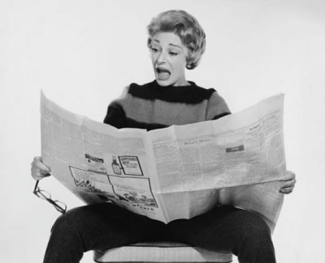 Mid adult woman reading a newspaper and looking surprised Canvas Art - (18 x 24)