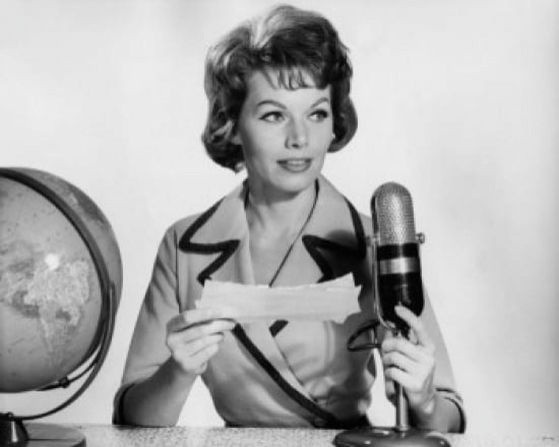 Mid adult woman reading a report on a microphone Canvas Art - (24 x 36)