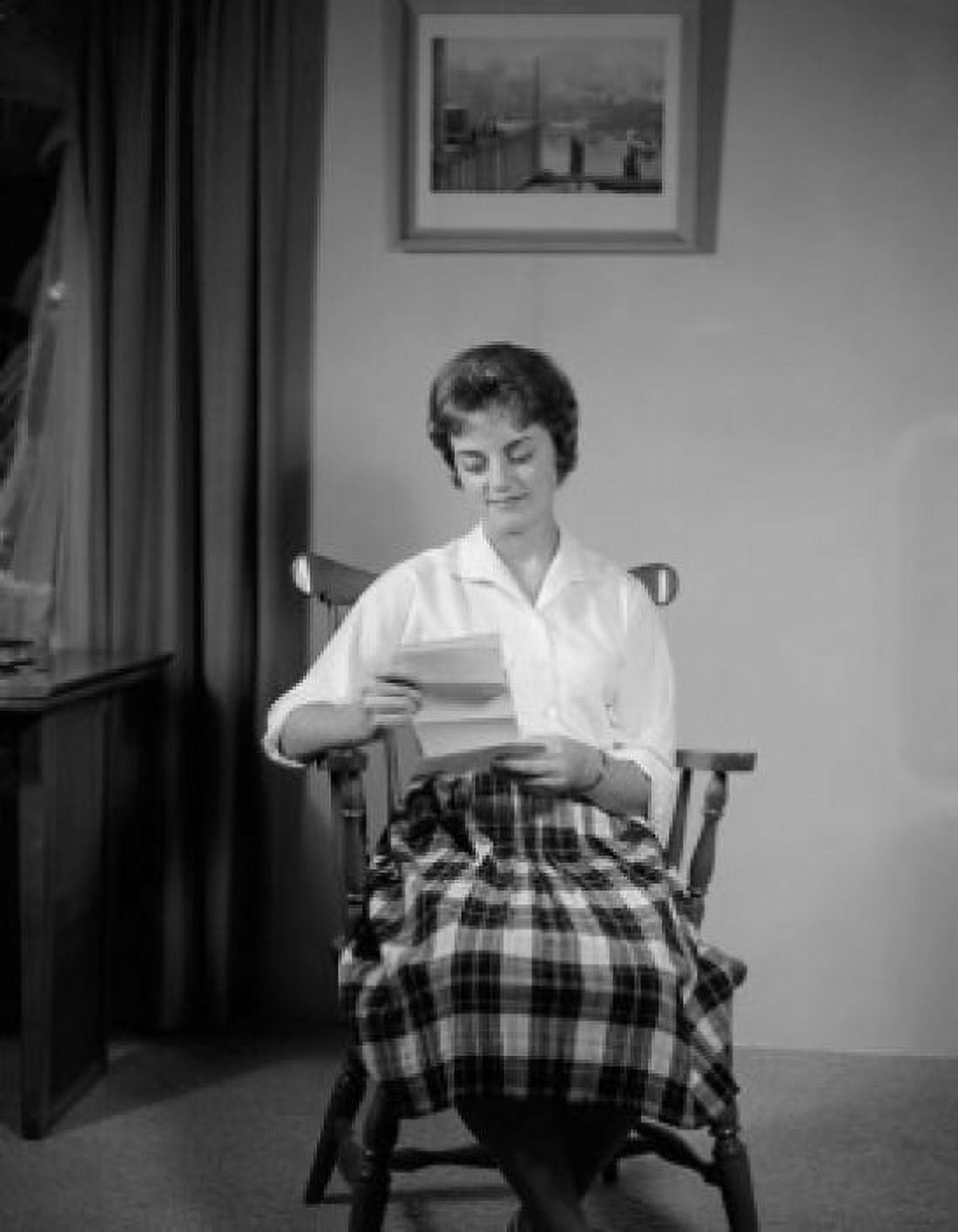 Mid adult woman reading letter Canvas Art - (18 x 24)