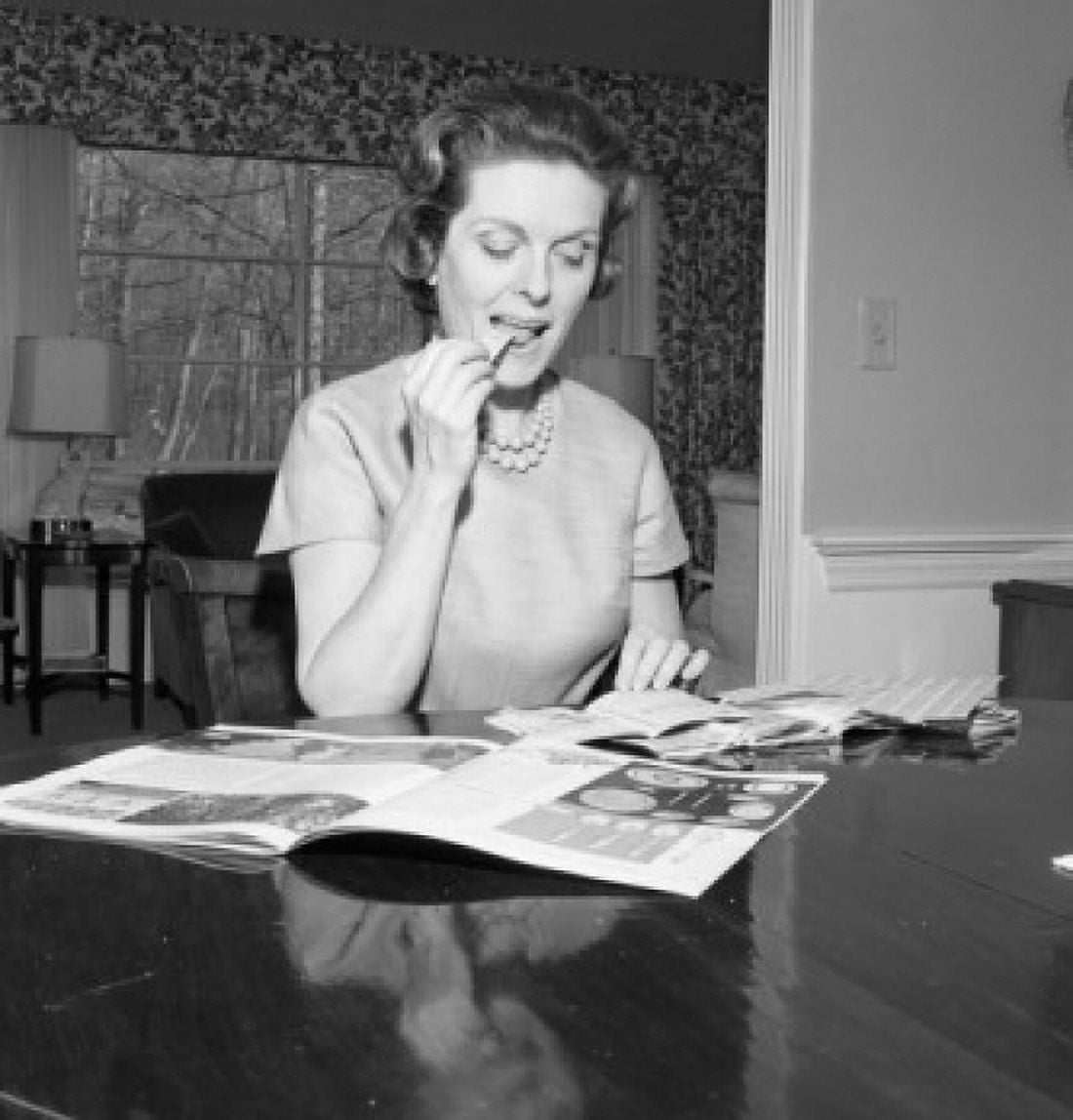 Mid adult woman reading magazine at home Canvas Art - (18 x 24)