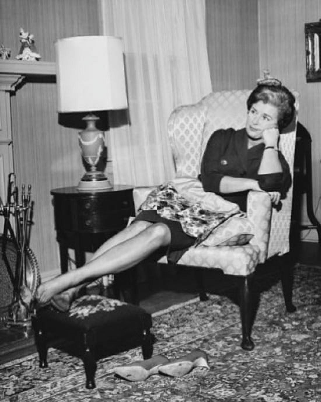 Mid adult woman reclining on an armchair Canvas Art - (18 x 24)