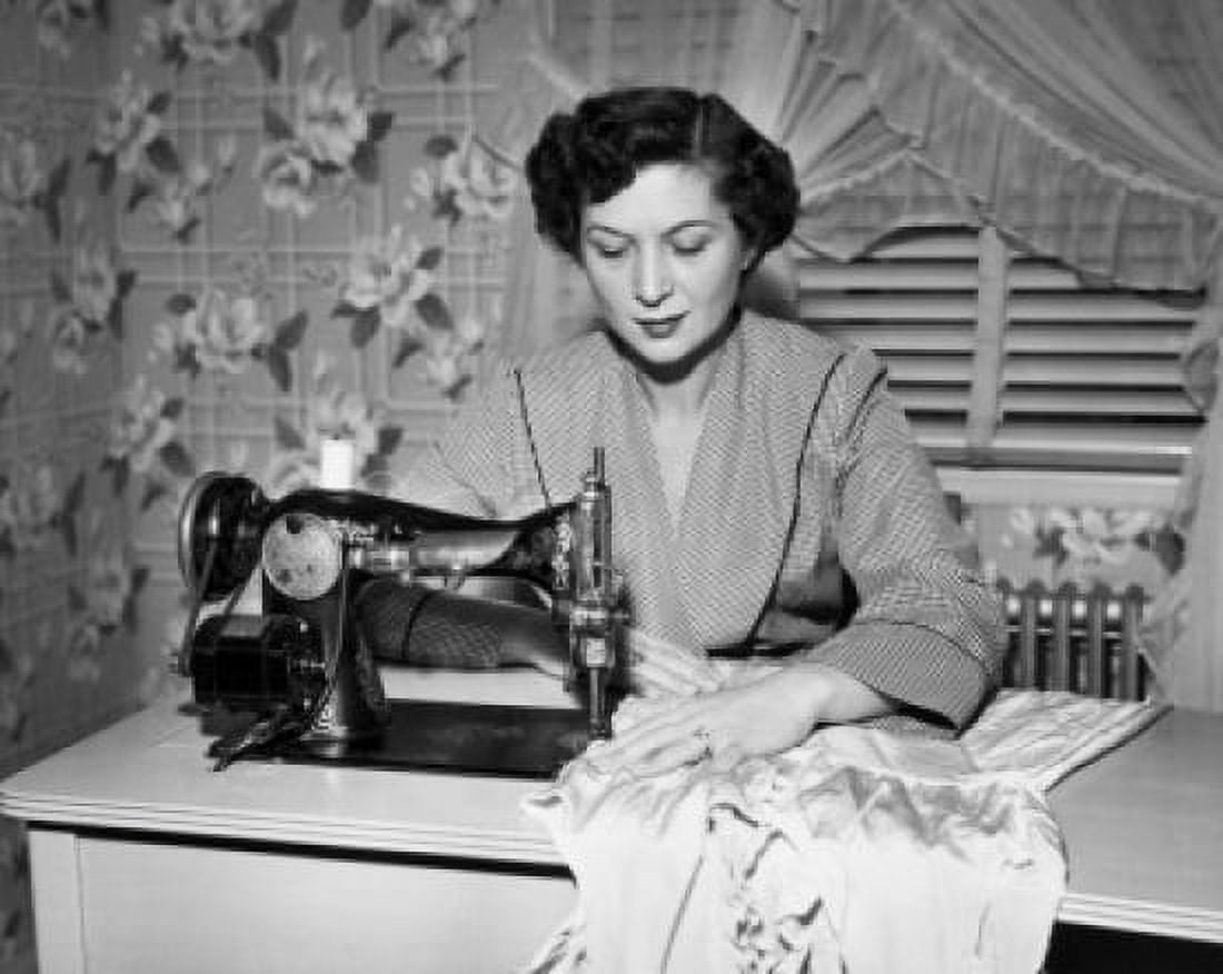 Mid adult woman sewing clothes with a sewing machine Canvas Art - (18 x 24)