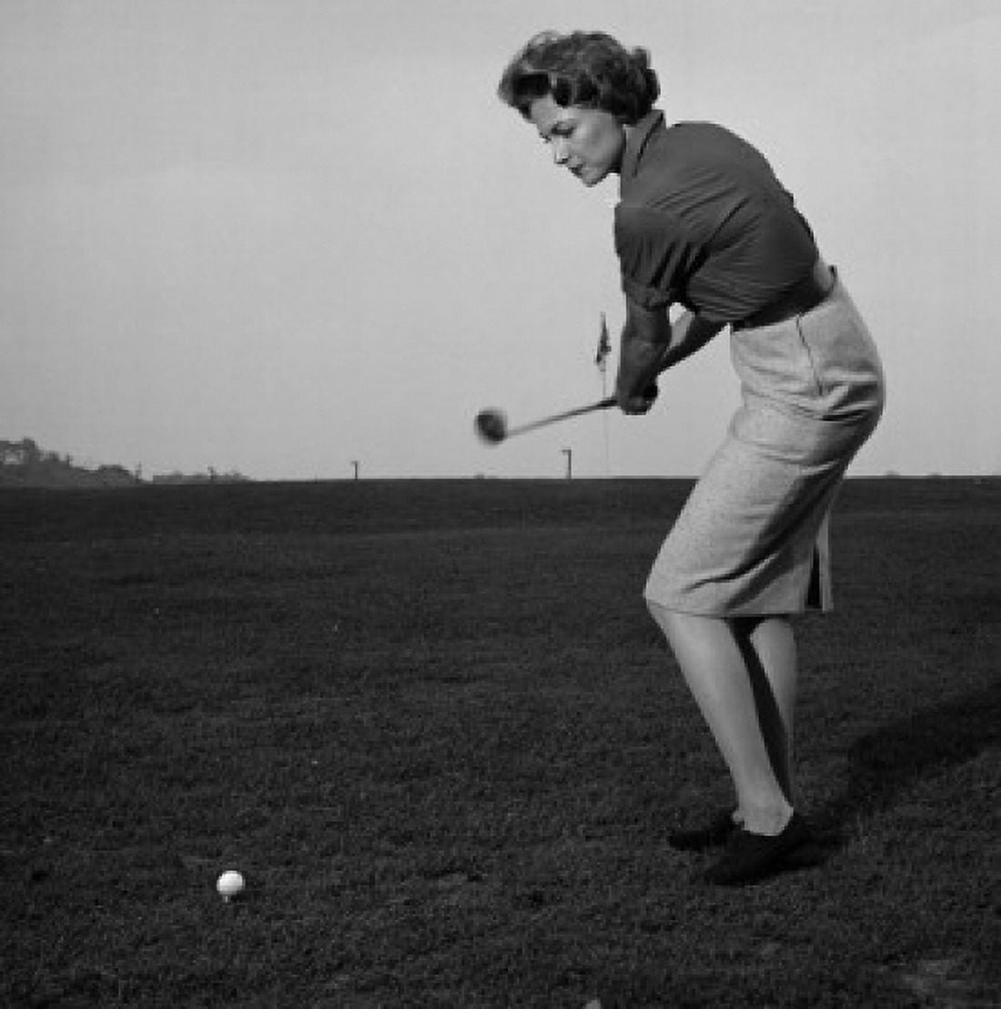Mid adult woman swinging a golf club on a golf course Canvas Art -  (24 x 36)