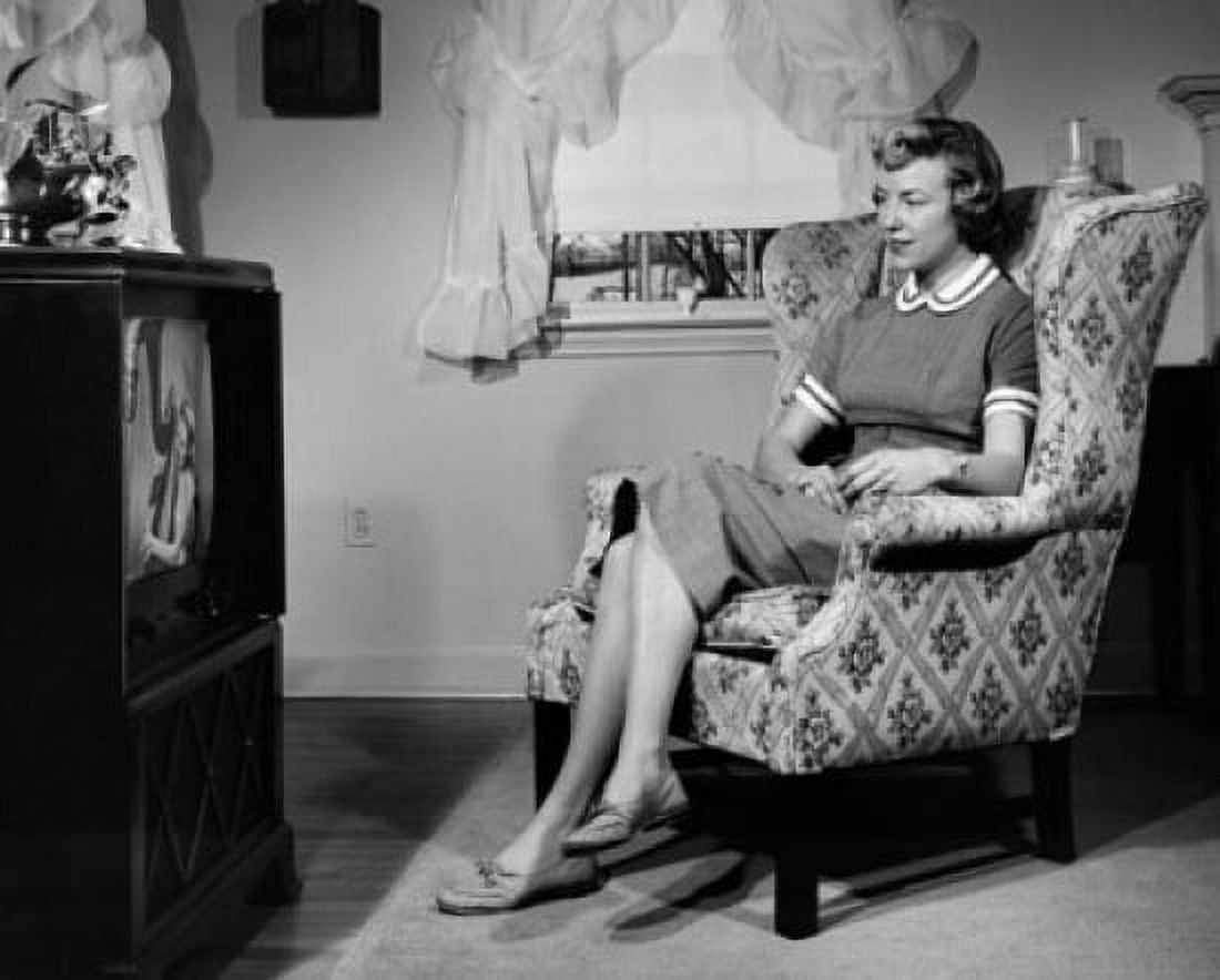 Mid adult woman watching television Canvas Art - (18 x 24)
