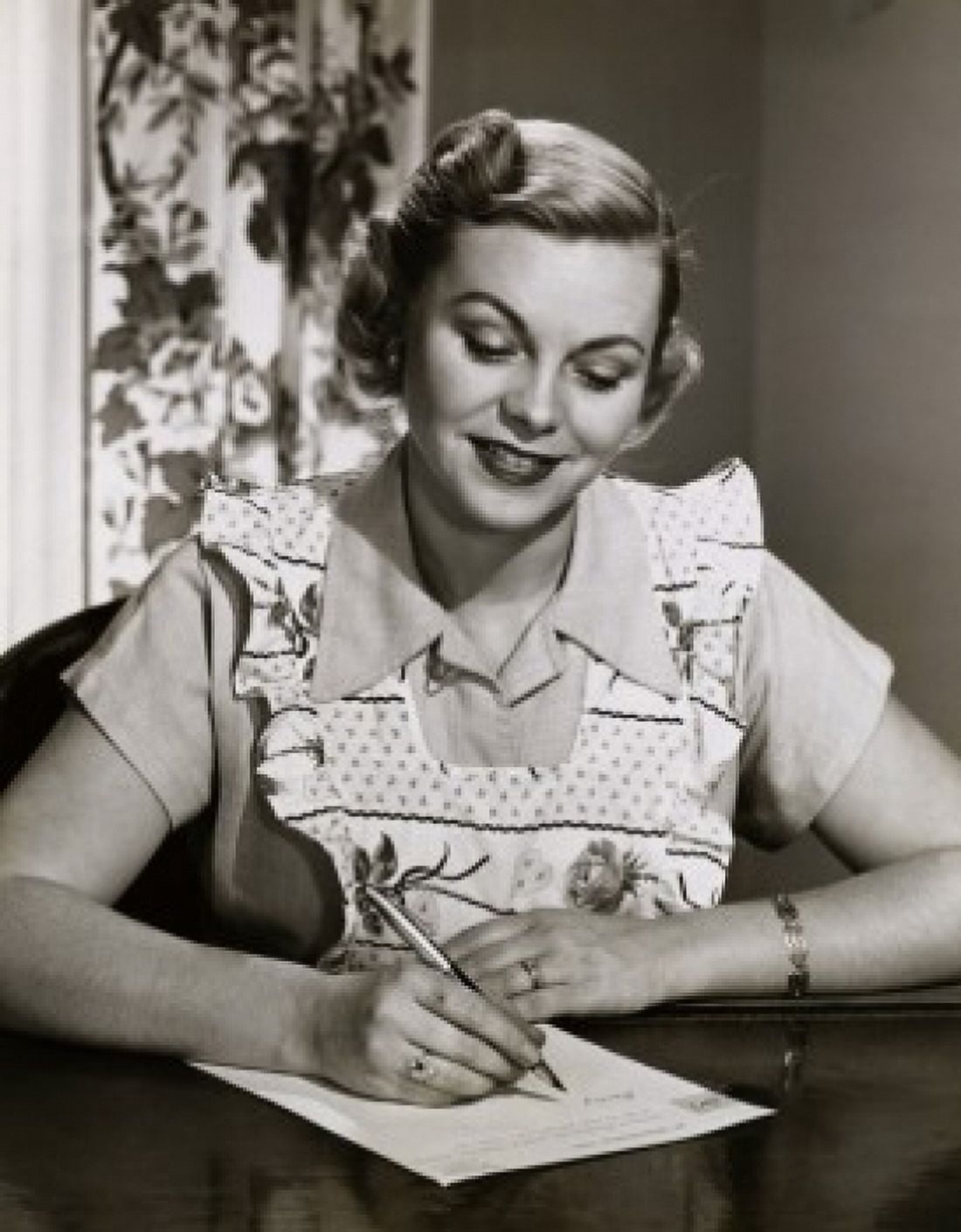 Mid adult woman writing a shopping list Canvas Art - (18 x 24)