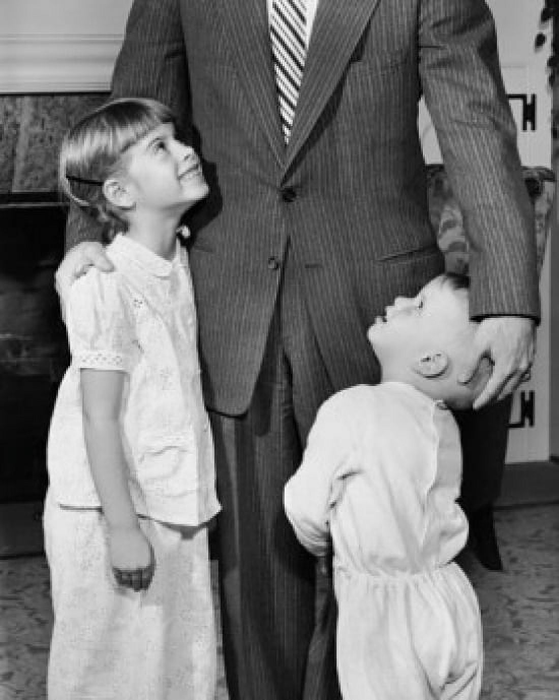 Mid section view of a father standing with his son and daughter Canvas Art - (18 x 24)