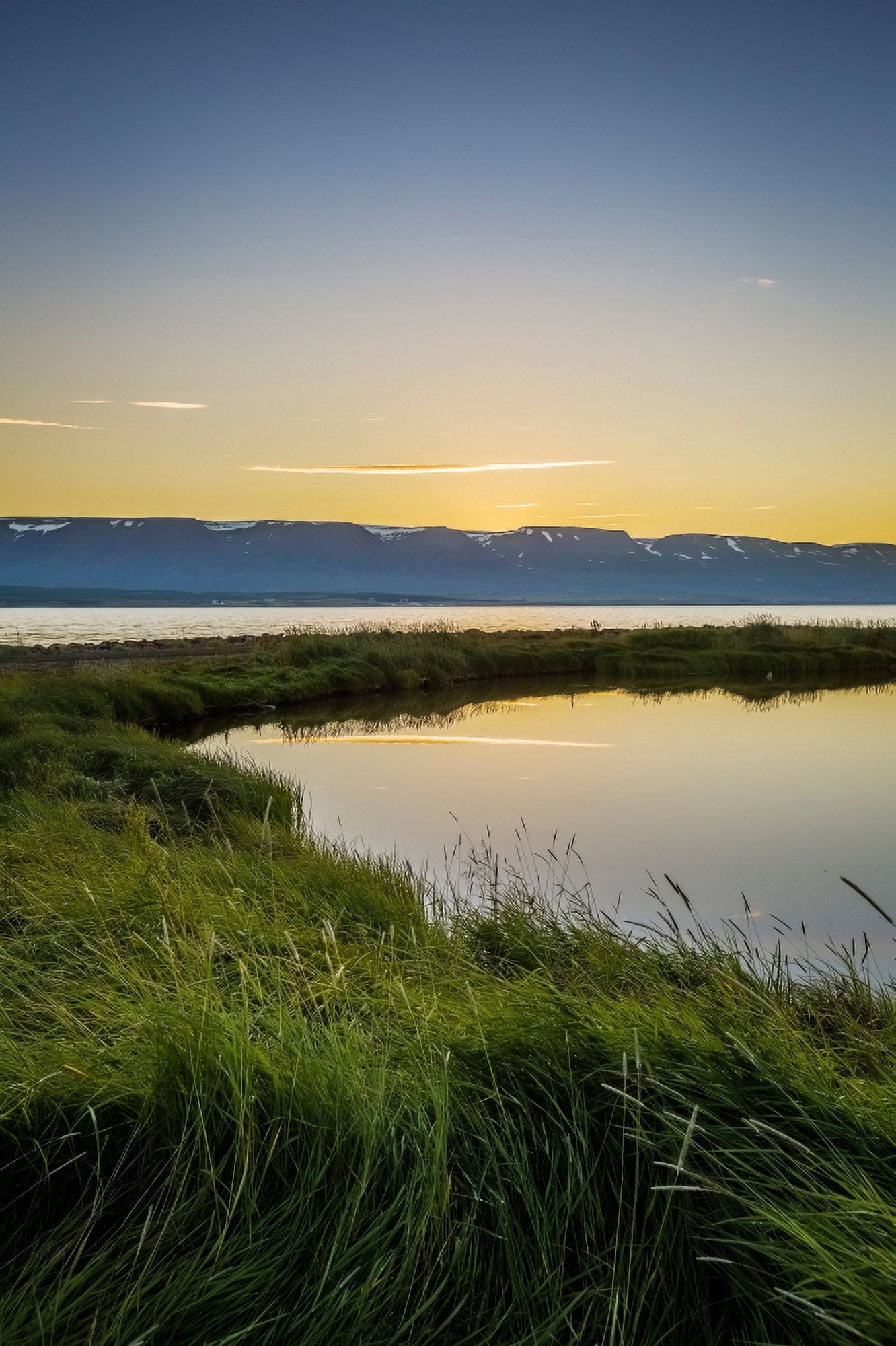 Midnight sun over Eyjafjordur Akureyri Iceland Canvas Art - Panoramic Images (27 x 9)