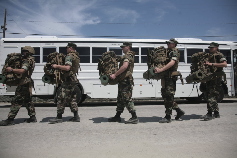 Midshipmen carry their packs and board a bus Canvas Art - Stocktrek Images (35 x 23)
