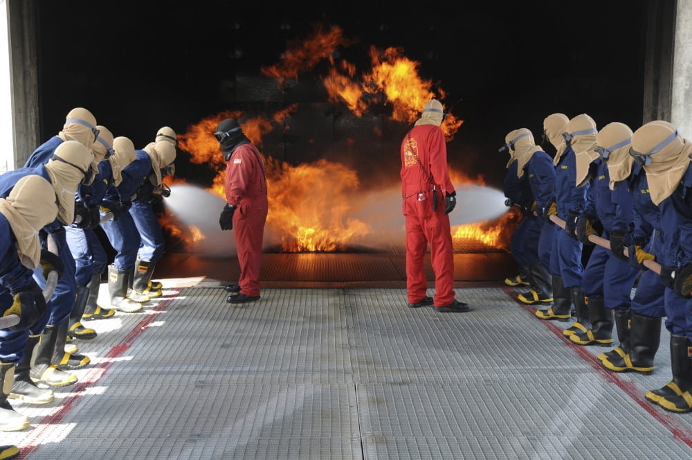 Midshipmen work together to battle a fire Canvas Art - Stocktrek Images (35 x 23)