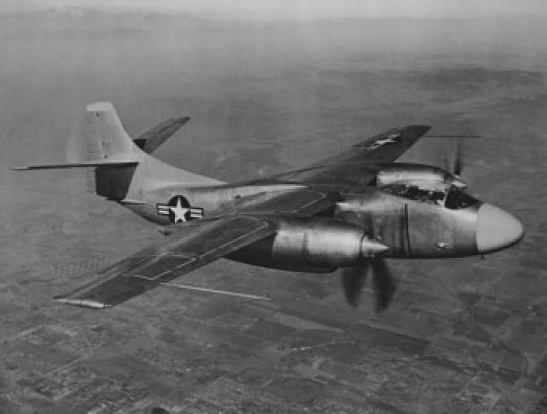 Military airplane in flight Canvas Art - (24 x 36)