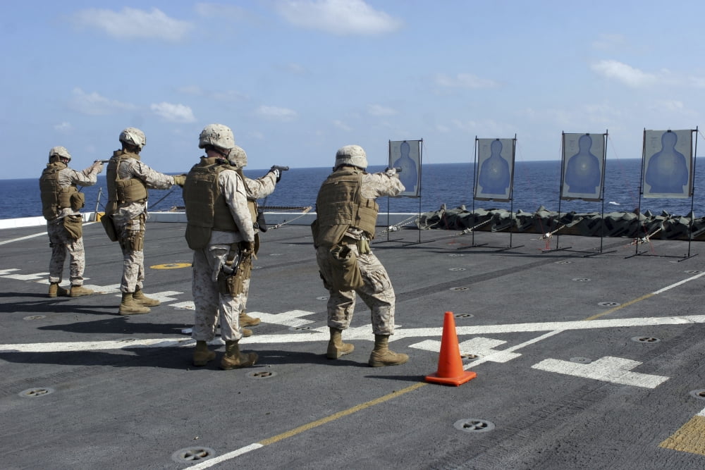 Military policemen train with the Berretta M9 9mm pistol aboard USS San Antonio Canvas Art - Stocktrek Images (34 x 23)