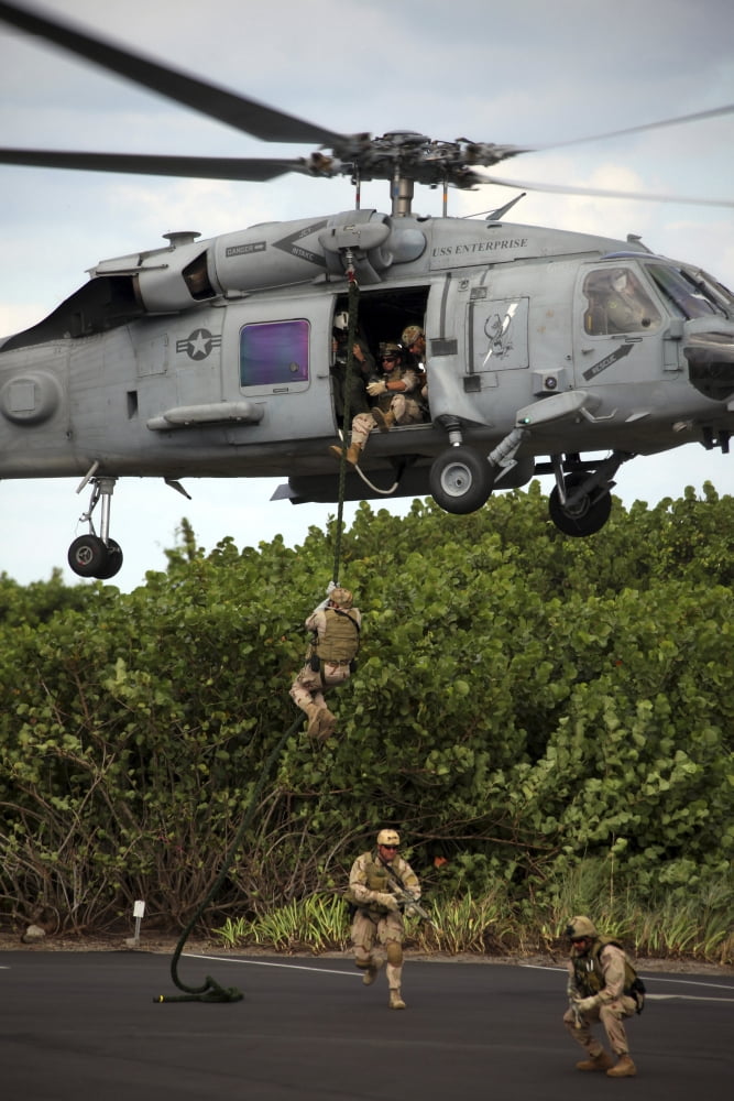 Military reserve Navy SEALs demonstrate fast-roping from a SH-60 Seahwak Canvas Art - Michael WoodStocktrek Images (23 x 34)