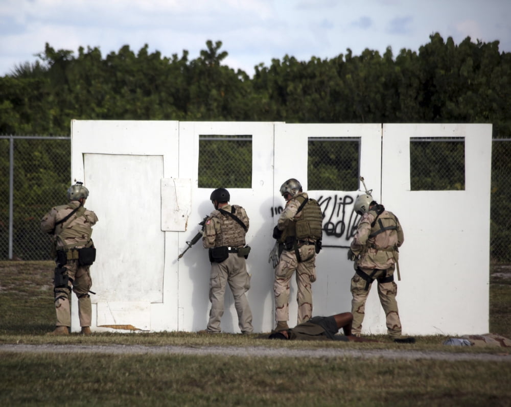Military reserve members prepare to conduct a mock doorway breach and assault Canvas Art - Michael WoodStocktrek Images (31 x 25)