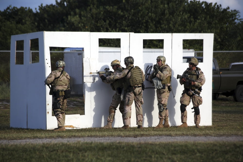 Military reserve members prepare to conduct a mock doorway breach and assault Canvas Art - Michael WoodStocktrek Images (34 x 23)