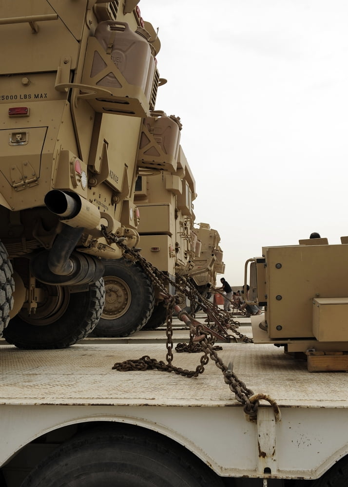 Military vehicles are locked down on semi trucks Canvas Art - Stocktrek Images (24 x 33)