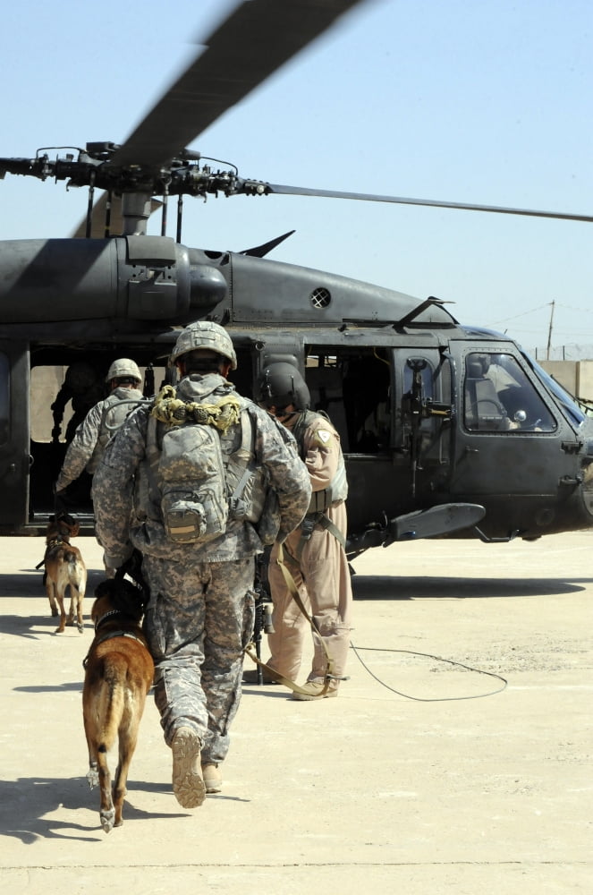 Military working dog handlers board a helicopter Canvas Art - Stocktrek Images (23 x 34)
