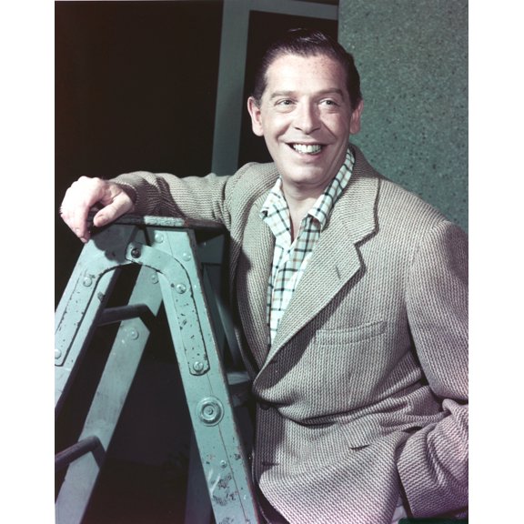 Milton Berle smiling on a Ladder Photo Print (8 x 10)