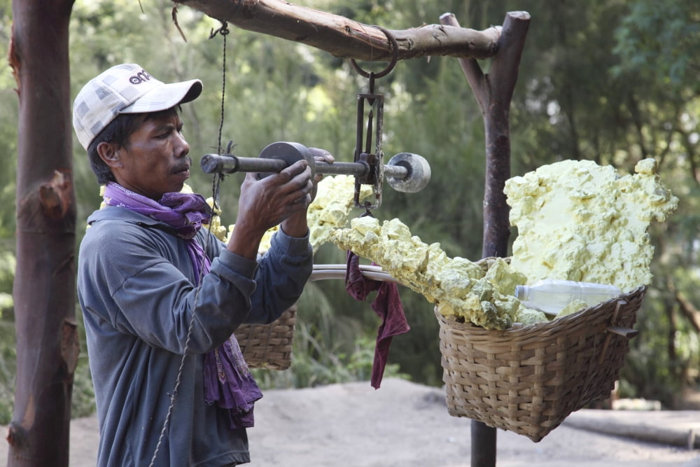 Miner adjusts weights on scale at weighing station Kawah Ijen volcano Java Indonesia Canvas Art - Richard RoscoeStocktrek Images (35 x 23)