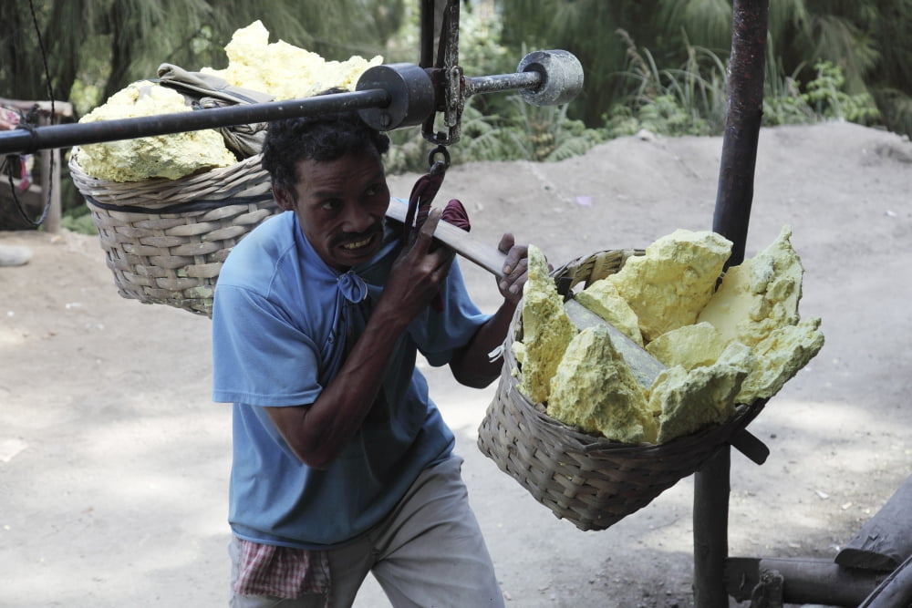 Miner attaches sulphur load to weighing station Kawah Ijen volcano Java Indonesia Canvas Art - Richard RoscoeStocktrek Images (35 x 23)