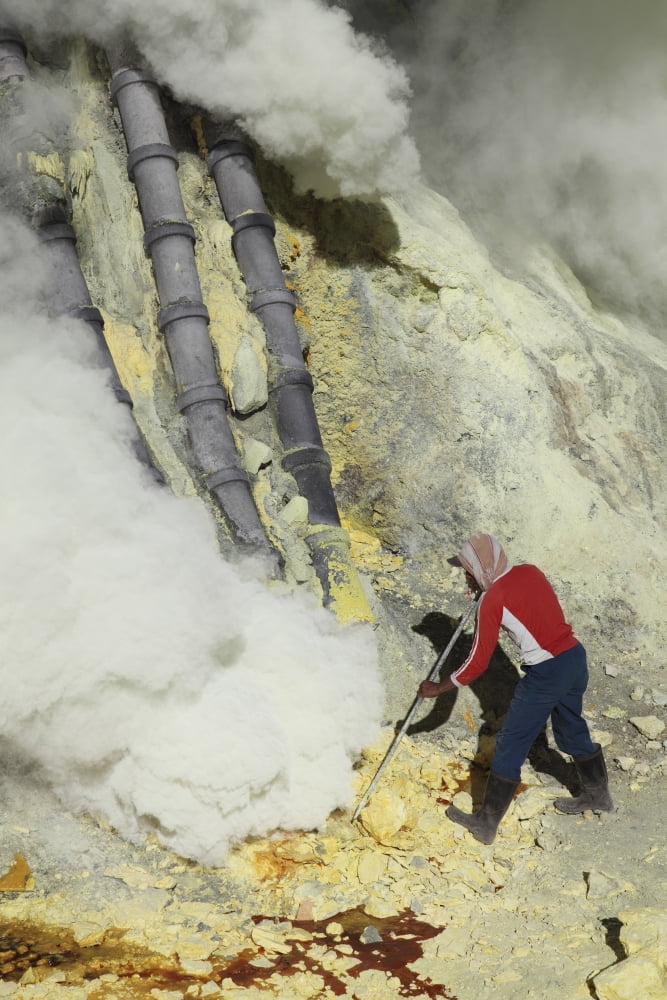 Miner breaking up sulphur deposits at Kawah Ijen Volcano Java Indonesia Canvas Art - Richard RoscoeStocktrek Images (12 x 18)