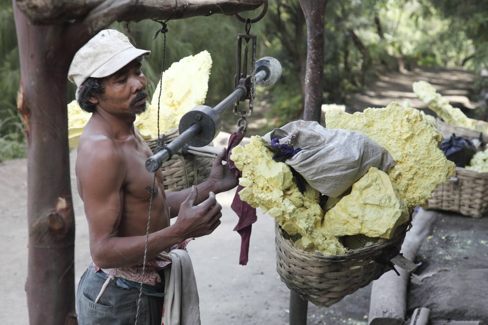 Miner checks the weight at sulphur weighing station Kawah Ijen volcano Java Indonesia Canvas Art - Richard RoscoeStocktrek Images (35 x 23)