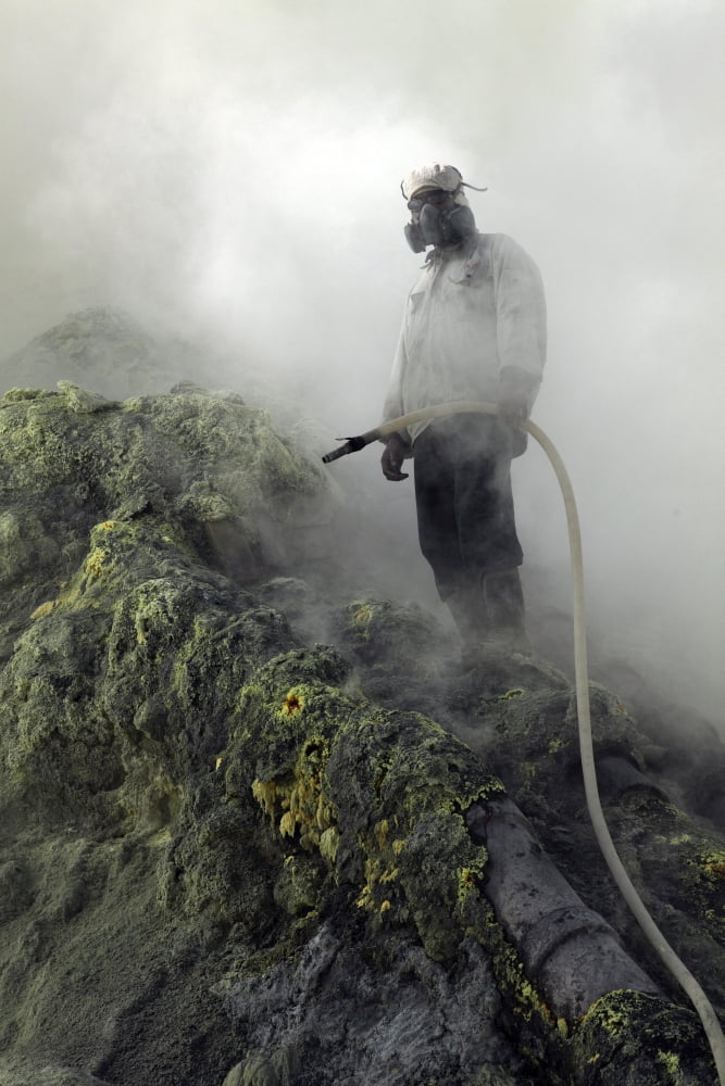 Miner cooling condensation pipes Kawah Ijen volcano Java Indonesia Canvas Art - Richard RoscoeStocktrek Images (23 x 35)