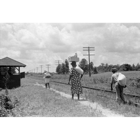 Mississippi Natchez 1940. Na Family Walking Along The Railroad Tracks In Natchez Mississippi. Photograph By Marion