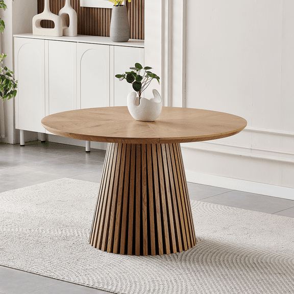 Modern round wooden dining table with a sleek, contemporary design. Ideal for family gatherings, its multi-functional, space-saving, and perfect for living and dining areas.