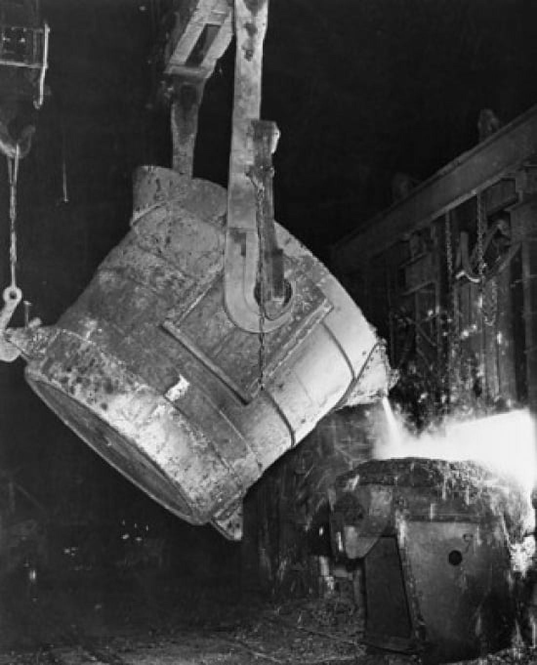 Molten steel pouring from a container into an ingot Canvas Art - (18 x 24)