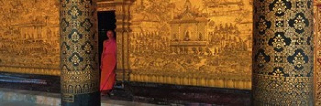 Monk in prayer hall at Wat Mai Buddhist Monastery Luang Prabang Laos Canvas Art - Panoramic Images (18 x 6)
