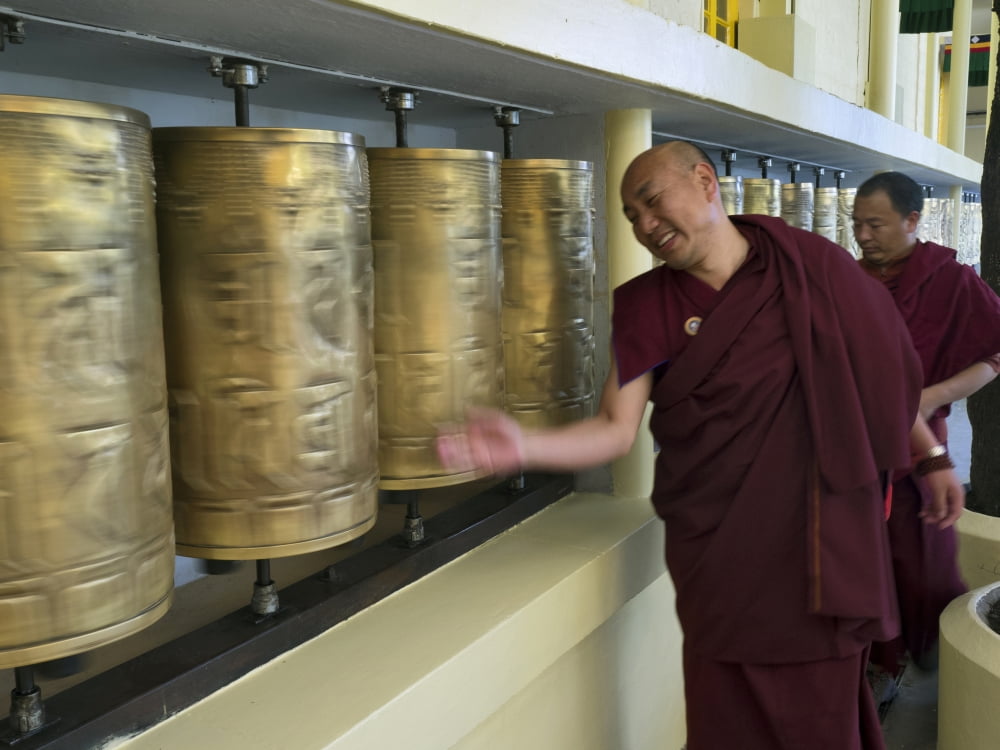 Monks spinning prayer wheels at Tsuglagkhang temple McLeod Ganj Dharamsala Himachal Pradesh India Canvas Art - Panoramic Images (12 x 16)