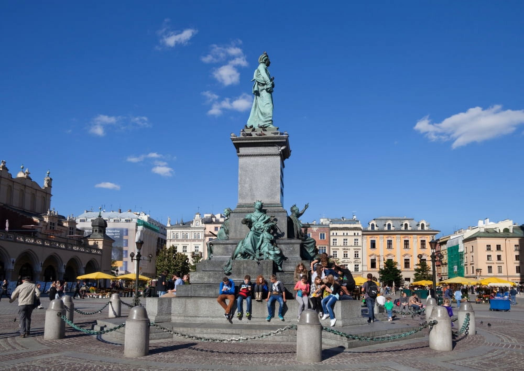 Monument to Adam Mickiewicz the great Polish Romantic poet of the 19th century A favourite meeting place in Rynek Glowny The Main Market Square Krakow Poland Canvas Art - Panoramic Images (12 x 36)