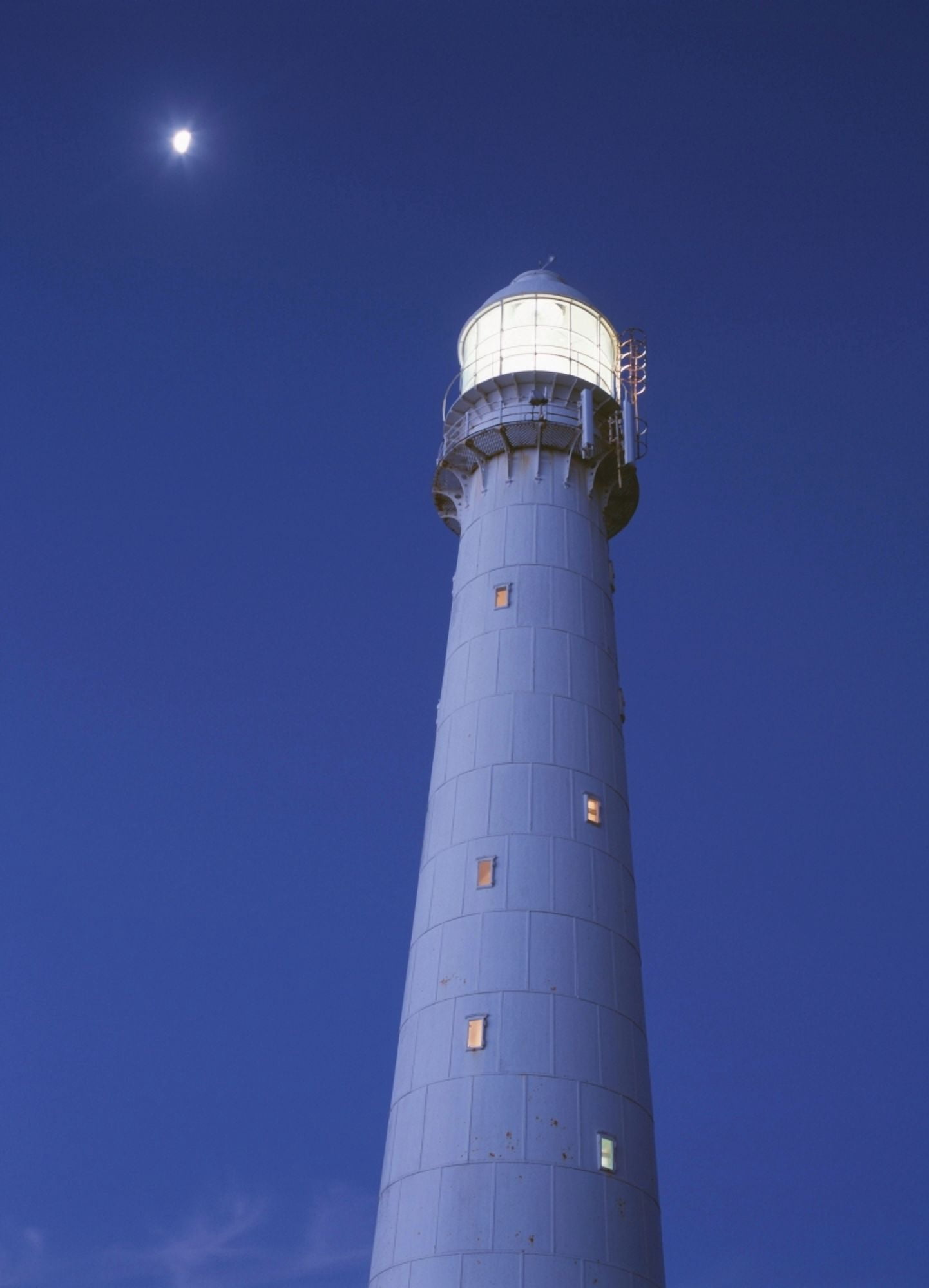 Moon Above Lighthouse At Dusk Canvas Art - Ian Cumming Design Pics (26 x 36)