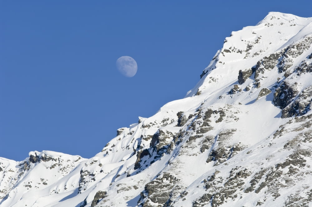 Moon Rising Over Snow Covered Mountain Peak At Hatcher Pass In Southcentral Alaska Canvas Art - Greg Hensel Design Pics (19 x 12)
