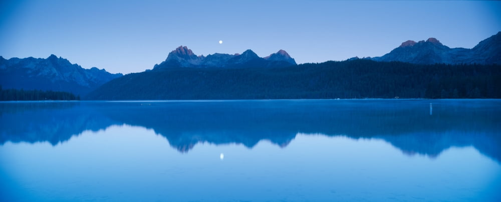 Moonset at sunrise over Redfish Lake and Sawtooth Mountains Idaho Canvas Art - Panoramic Images (27 x 9)