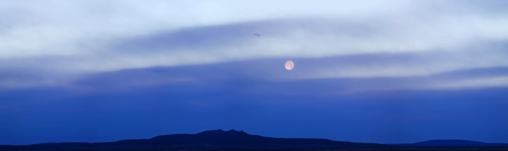 Moonset over mountain Tres Orejas Taos County New Mexico USA Canvas Art - Panoramic Images (27 x 9)