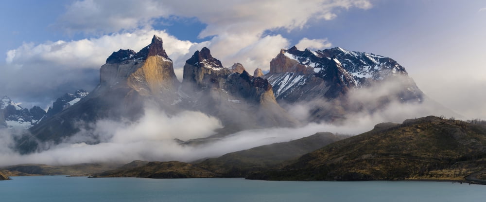 Morning clouds over the peaks of the Cuernos del Paine and Lake Pehoe Torres Del Paine National Park Chile Canvas Art - Panoramic Images (27 x 9)